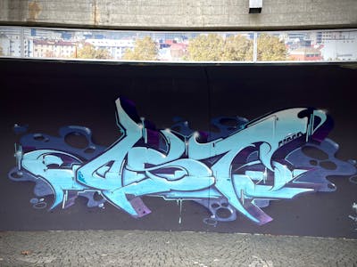 Light Blue and Blue Stylewriting by mobar and Ost crew. This Graffiti is located in Innsbruck, Austria and was created in 2024. This Graffiti can be described as Stylewriting and Wall of Fame.