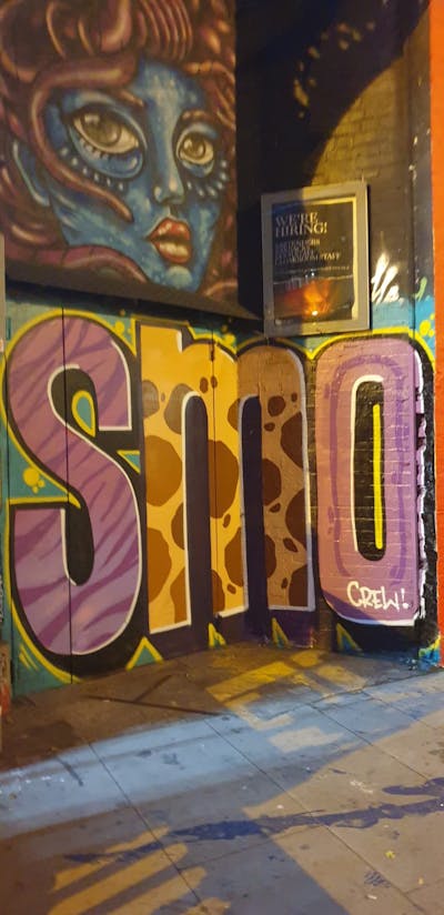 Beige and Coralle and Colorful Stylewriting by Sky High and smo__crew. This Graffiti is located in London, United Kingdom and was created in 2023. This Graffiti can be described as Stylewriting and Characters.