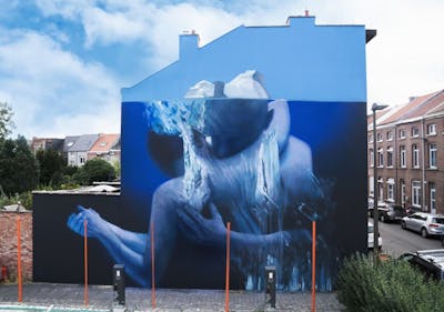 Blue and Light Blue Characters by Iota. This Graffiti is located in Netherlands and was created in 2021. This Graffiti can be described as Characters, Murals and Futuristic.