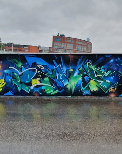 Blue and Green and Light Green Stylewriting by Rymd and Rymds. This Graffiti is located in Stockholm, Sweden and was created in 2021. This Graffiti can be described as Stylewriting and Wall of Fame.