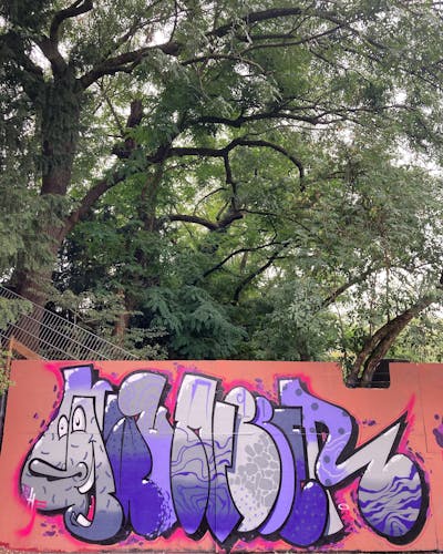 Violet and Grey Stylewriting by Gauner. This Graffiti is located in Germany and was created in 2022. This Graffiti can be described as Stylewriting, Wall of Fame and Characters.