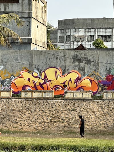Orange and Beige Stylewriting by Jibo and MDS. This Graffiti is located in Lombok, Indonesia and was created in 2023. This Graffiti can be described as Stylewriting, Street Bombing and Atmosphere.