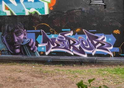 Violet and Light Blue Stylewriting by MIREA. This Graffiti is located in Hannover, Germany and was created in 2023. This Graffiti can be described as Stylewriting, Characters and Wall of Fame.
