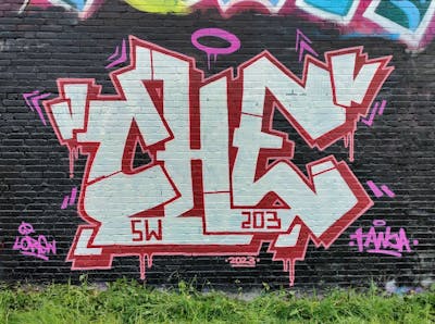 Beige and Red and Black Stylewriting by CHE. This Graffiti is located in Heerlen, Netherlands and was created in 2023.