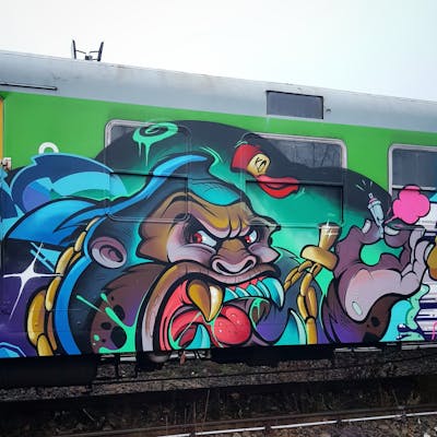 Colorful Characters by tempz. This Graffiti is located in Warsaw, Poland and was created in 2021. This Graffiti can be described as Characters and Trains.