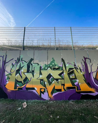 Violet and Green and Orange Stylewriting by PUCK. This Graffiti is located in Köln, Germany and was created in 2022.