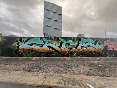 Cyan and Light Blue and Brown Stylewriting by Chr15, TMF and HG. This Graffiti is located in Berlin, Germany and was created in 2024. This Graffiti can be described as Stylewriting and Wall of Fame.