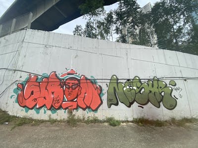 Red and Green Stylewriting by Sirom and Nesyr. This Graffiti is located in Kuala Lumpur, Malaysia and was created in 2022. This Graffiti can be described as Stylewriting, Throw Up and Characters.