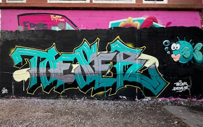 Cyan and Colorful Stylewriting by TOESER ONE. This Graffiti is located in Hamburg, Germany and was created in 2024. This Graffiti can be described as Stylewriting and Wall of Fame.