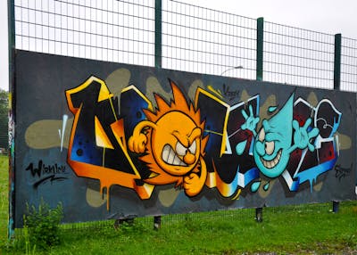 Orange and Colorful and Light Blue Stylewriting by HAMPI and BISTE. This Graffiti is located in MÜNSTER, Germany and was created in 2023. This Graffiti can be described as Stylewriting, Characters and Wall of Fame.