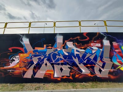 Colorful and Orange and Blue Stylewriting by Fems173. This Graffiti is located in lublin, Poland and was created in 2023. This Graffiti can be described as Stylewriting, Characters and Wall of Fame.