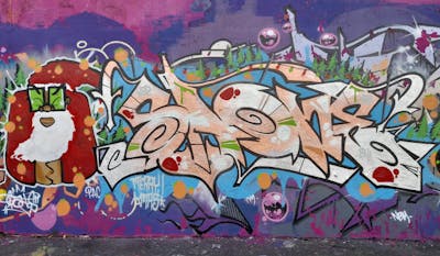 Chrome and Colorful Stylewriting by SAO2971. This Graffiti is located in St helier, Jersey and was created in 2022. This Graffiti can be described as Stylewriting, Characters and Wall of Fame.