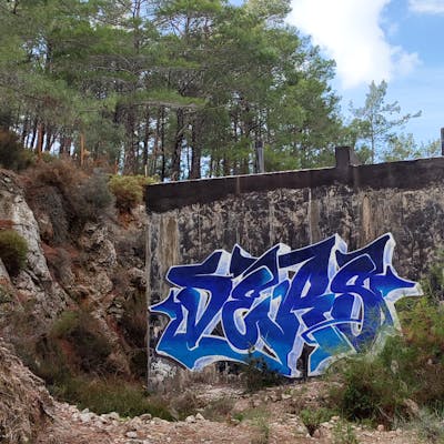 Blue and White Stylewriting by Ders. This Graffiti is located in Fethiye, Turkey and was created in 2023. This Graffiti can be described as Stylewriting and Abandoned.