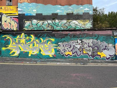 Colorful and Cyan Stylewriting by Micro79, GATSB and TNS. This Graffiti is located in Newcastle, United Kingdom and was created in 2022. This Graffiti can be described as Stylewriting, Characters and Wall of Fame.