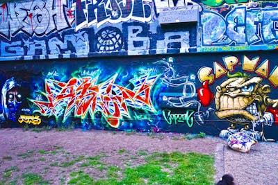 Colorful Stylewriting by Jason one, Juks and Capone. This Graffiti is located in Hamburg, Germany and was created in 2022. This Graffiti can be described as Stylewriting, Characters and Wall of Fame.