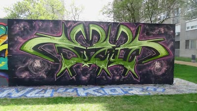 Coralle and Light Green Stylewriting by Fuzio. This Graffiti is located in Szolnok, Hungary and was created in 2021. This Graffiti can be described as Stylewriting and Wall of Fame.