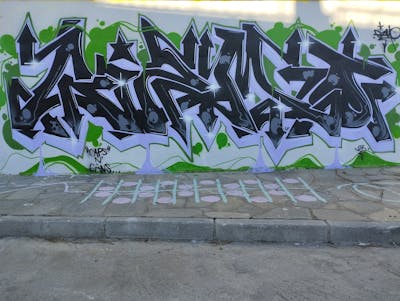 Black and Light Green and Violet Stylewriting by Gizmo. This Graffiti is located in Kavala, Greece and was created in 2023.