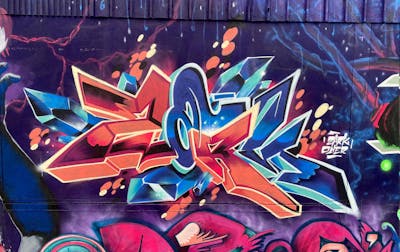 Colorful and Orange and Blue Stylewriting by ZARK ONER. This Graffiti is located in Bremen, Germany and was created in 2021.