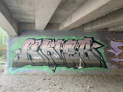 Beige and Light Green Stylewriting by KNEB. This Graffiti is located in Limassol, Cyprus and was created in 2022. This Graffiti can be described as Stylewriting and Abandoned.