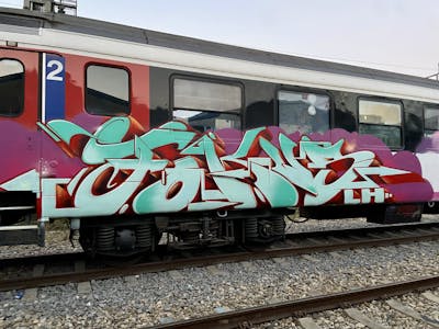 Cyan and Red Stylewriting by FOKUS.81. This Graffiti is located in Basel, Switzerland and was created in 2021. This Graffiti can be described as Stylewriting and Trains.