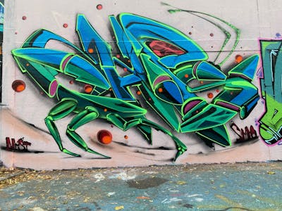 Green and Blue Stylewriting by CDSK and Chips. This Graffiti is located in London, United Kingdom and was created in 2022. This Graffiti can be described as Stylewriting, Characters and Wall of Fame.