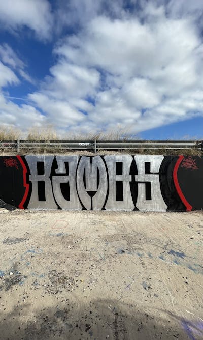 Black and Red and Chrome Stylewriting by Vamos and Bamod. This Graffiti is located in Valencia, Spain and was created in 2022.