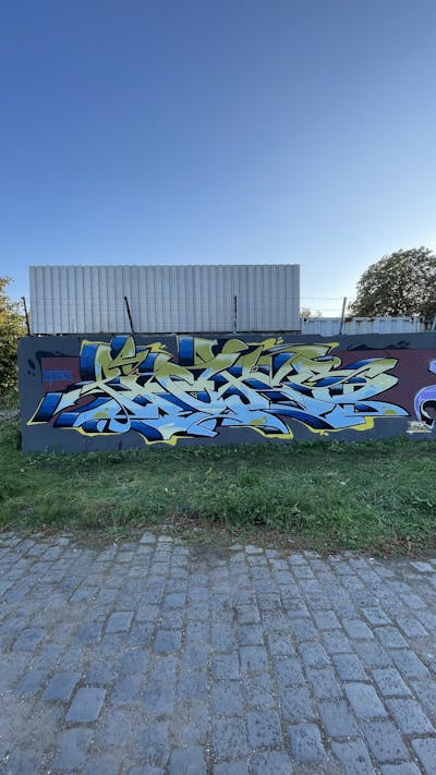 Light Blue and Blue and Light Green Stylewriting by Picks. This Graffiti is located in Hettstedt, Germany and was created in 2023. This Graffiti can be described as Stylewriting and Wall of Fame.