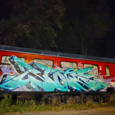 Red and Cyan Stylewriting by Riots. This Graffiti is located in Jena, Germany and was created in 2022. This Graffiti can be described as Stylewriting, Characters, Trains, Wall of Fame and Freights.