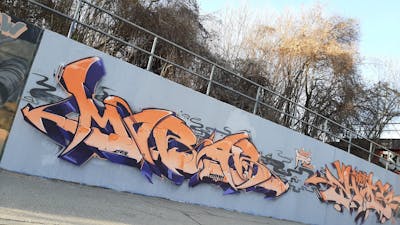 Orange and Blue Stylewriting by mobar and Eksid. This Graffiti is located in Ingolstadt, Germany and was created in 2022.
