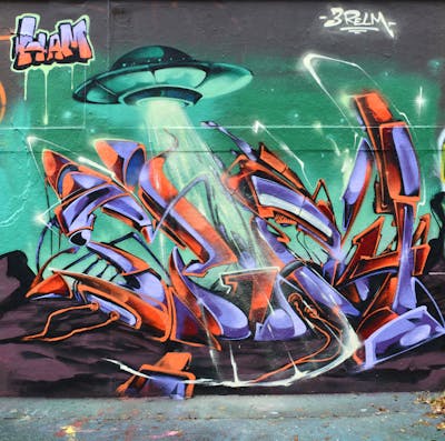 Violet and Orange and Cyan Stylewriting by CDSK and Chips. This Graffiti is located in London, United Kingdom and was created in 2023. This Graffiti can be described as Stylewriting, Characters and Wall of Fame.