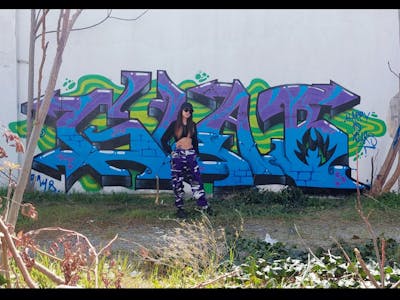 Light Blue and Violet Stylewriting by GLAB. This Graffiti is located in Thessaloniki, Greece and was created in 2023.