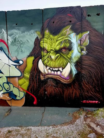 Light Green and Brown Characters by CUORE. This Graffiti is located in Strausberg, Germany and was created in 2022.