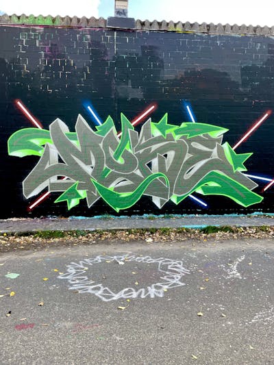 Light Green and Grey Stylewriting by MOKE. This Graffiti is located in Berlin, Germany and was created in 2022. This Graffiti can be described as Stylewriting and Wall of Fame.