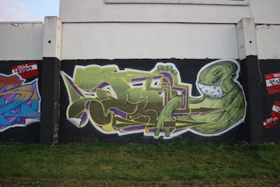 Light Green and Violet Stylewriting by Diro, dwscrew, ink and hellboys. This Graffiti is located in Halle/Saale, Germany and was created in 2021. This Graffiti can be described as Stylewriting, Characters and Wall of Fame.