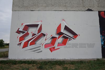 Red and Grey Stylewriting by Kan and TMF. This Graffiti is located in Erfurt, Germany and was created in 2022. This Graffiti can be described as Stylewriting, Wall of Fame and Futuristic.