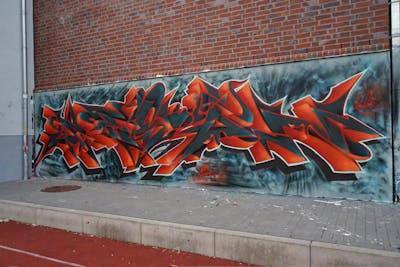 Grey and Red and Orange Stylewriting by Jason one. This Graffiti is located in Lüneburg, Germany and was created in 2023. This Graffiti can be described as Stylewriting and Wall of Fame.