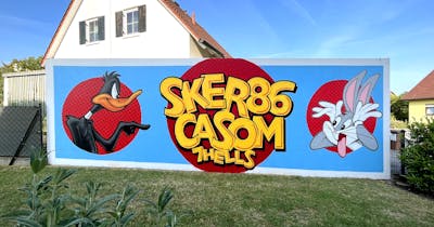 Colorful and Light Blue and Red Stylewriting by casom and Sker86. This Graffiti is located in Hammelburg, Germany and was created in 2023. This Graffiti can be described as Stylewriting and Characters.