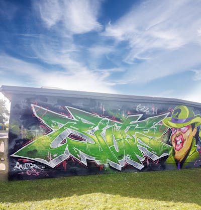 Light Green and Grey Stylewriting by Riots and Able2. This Graffiti is located in Oschatz, Germany and was created in 2022. This Graffiti can be described as Stylewriting, Characters and Wall of Fame.