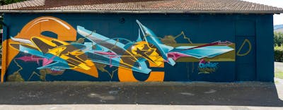 Cyan and Orange and Colorful Stylewriting by Syck, KKP, ABS and Los Capitanos. This Graffiti is located in Bielefeld, Germany and was created in 2023.