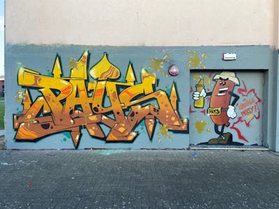 Yellow and Brown Stylewriting by Pays1. This Graffiti is located in Germany and was created in 2024. This Graffiti can be described as Stylewriting and Characters.