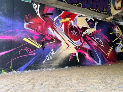 Colorful and Red Stylewriting by SmakOne. This Graffiti is located in hanover, Germany and was created in 2022. This Graffiti can be described as Stylewriting and Wall of Fame.
