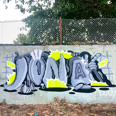 Grey and Yellow Stylewriting by JINAK. This Graffiti is located in Batam, Indonesia and was created in 2022. This Graffiti can be described as Stylewriting and Characters.