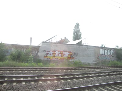 White and Yellow Stylewriting by urine, Pizar and OST. This Graffiti is located in Leipzig, Germany and was created in 2010. This Graffiti can be described as Stylewriting and Line Bombing.