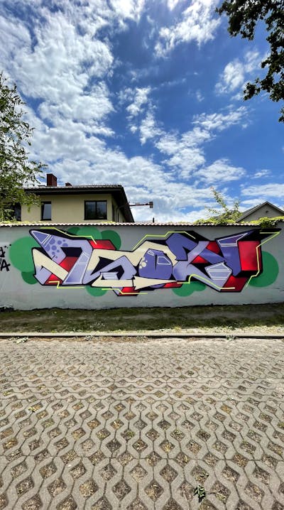 Colorful Wall of Fame by Asot. This Graffiti is located in Poland and was created in 2022. This Graffiti can be described as Wall of Fame and Stylewriting.
