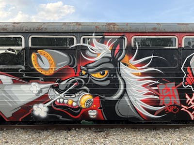 Black and Grey and Red Characters by PETION. This Graffiti is located in Pleszew, Poland and was created in 2023. This Graffiti can be described as Characters and Trains.