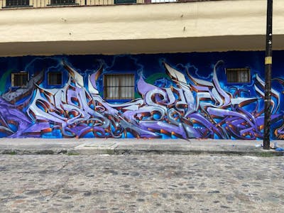 Blue and Violet Stylewriting by Jher and Jher451. This Graffiti is located in PUERTO VALLARTA, Mexico and was created in 2021. This Graffiti can be described as Stylewriting.