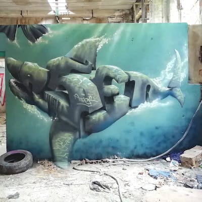 Grey and Cyan Stylewriting by Aser. This Graffiti is located in Leipzig, Germany and was created in 2022. This Graffiti can be described as Stylewriting, Characters, 3D, Streetart and Abandoned.