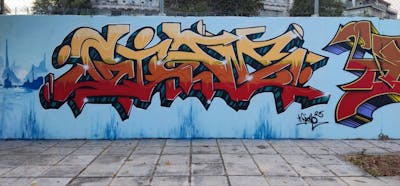 Beige and Brown and Light Blue Stylewriting by Gizmo. This Graffiti is located in Thessaloniki, Greece and was created in 2023. This Graffiti can be described as Stylewriting and Wall of Fame.
