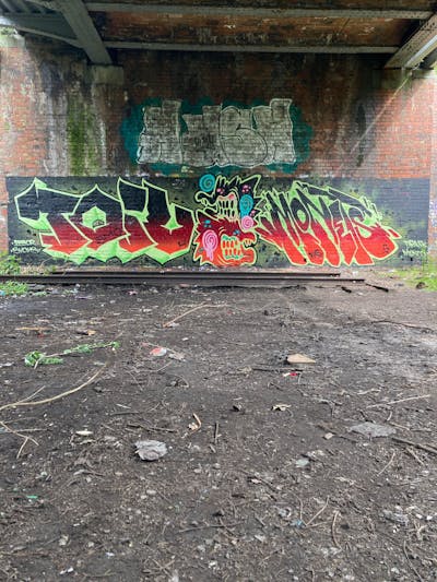Red and Light Green and Black Stylewriting by smo__crew, monets and Toile. This Graffiti is located in Wolverhampton, United Kingdom and was created in 2023. This Graffiti can be described as Stylewriting, Characters and Abandoned.