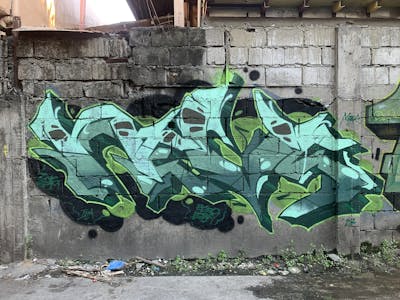 Green and Light Green and Cyan Stylewriting by Nevs. This Graffiti is located in Philippines and was created in 2023. This Graffiti can be described as Stylewriting and Abandoned.